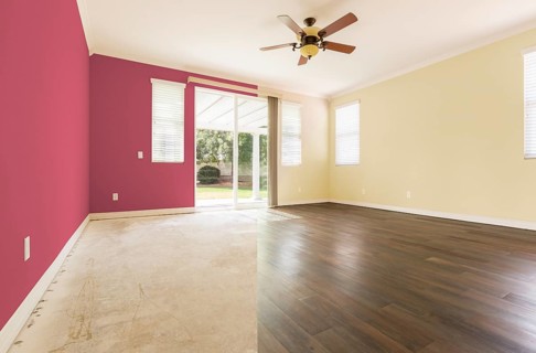 Empty room with cross section showing before and after with new wood floor and paint