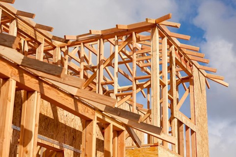 Abstract of wood home framing at construction site