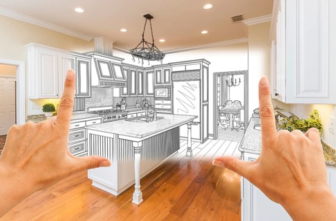 Female hands framing custom kitchen design drawing and square photo combination