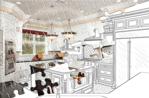 Puzzle pieces fitting together revealing finished kitchen build over drawing
