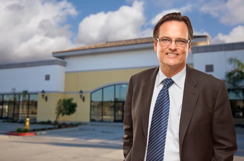 Handsome bussinesman in front of vacant office building