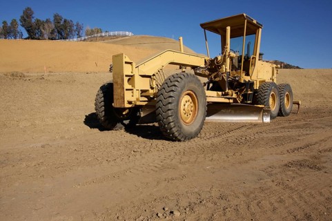 Tractor at a construction site and dirt lot