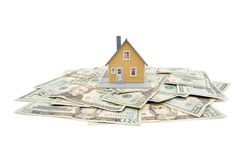 Home and money isolated on a white background