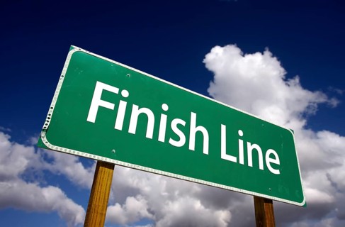 Finish line road sign with dramatic clouds and sky