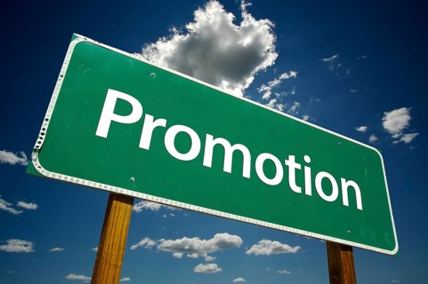 Promotion road sign with dramatic clouds and sky