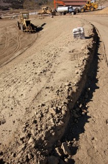 Sandbags & machinery at construction site