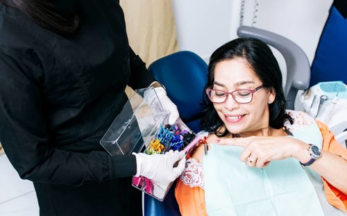 Patient with dentist choosing dental braces