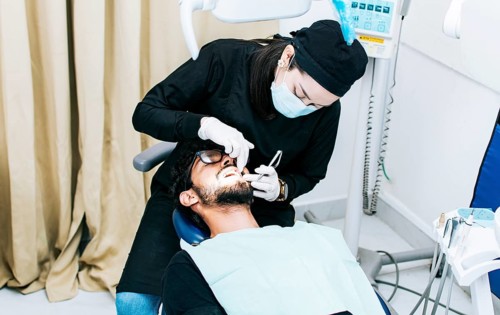 Dentist performing dental checkup