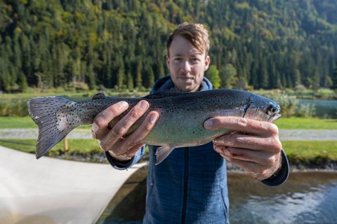 Man holding caught trout