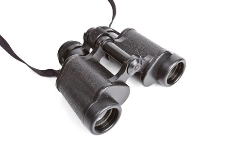 Black binoculars isolated on white background