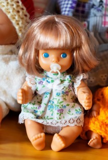 Portrait of an old decorative baby doll