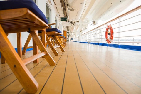 Abstract deck view of luxury passenger cruise ship and railing