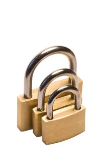 Three padlocks of different size isolated on white