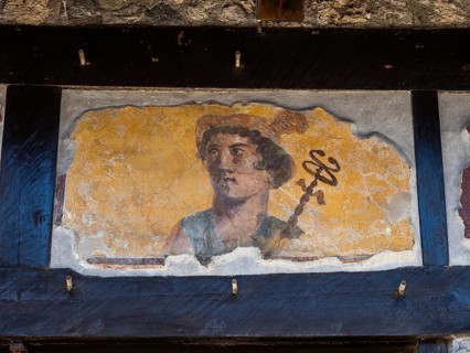 Painted head of a patron god