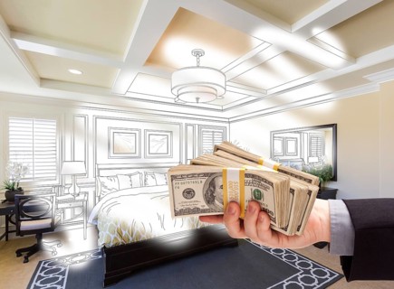 Man handing over stack of money above bedroom drawing photograph combination