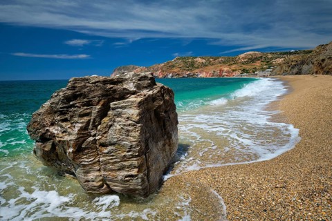 Rocks on Paleochori beach and waves of Aegean sea