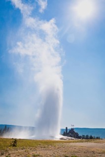 Old faithful geyser erupting at yellowstone national park