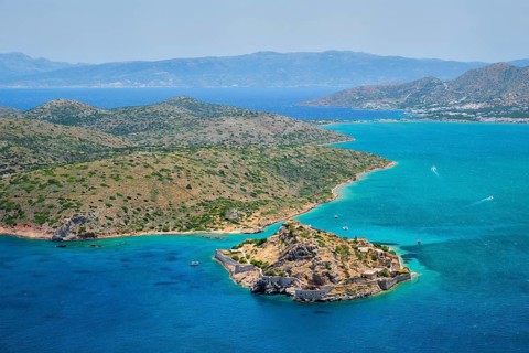 Island of Spinalonga with old fortress former leper colony and the bay of Elounda