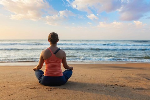 Young sporty fit woman doing yoga