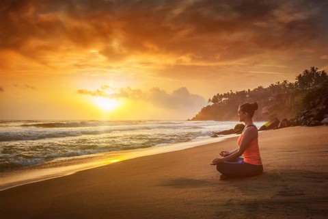 Young sporty fit woman doing yoga