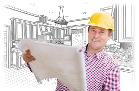 Smiling contractor holding blueprints over custom kitchen drawing