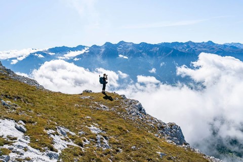 Hikers above the clouds