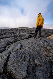 Tourist standing on petrified lava