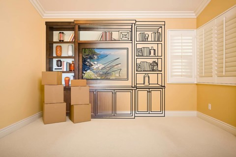 Moving boxes in room with entertainment unit drawing gradating to photograph