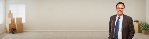 Adult businessman inside room with boxes banner