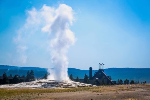 Old faithful geyser erupting at yellowstone national park