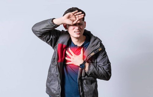 Man with heart pain on isolated background