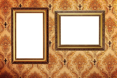 Vintage gold plated picture frames on retro wallpaper background