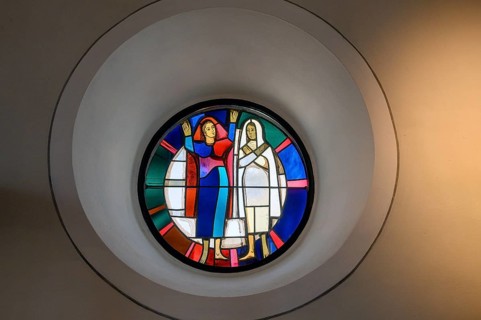 Modern church window with two figures