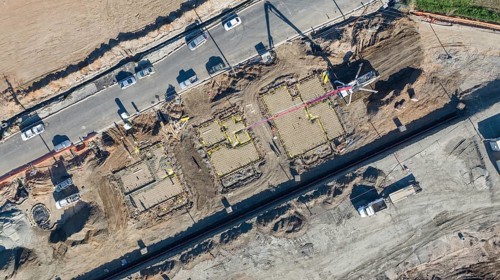 Drone aerial view of home construction site early stage