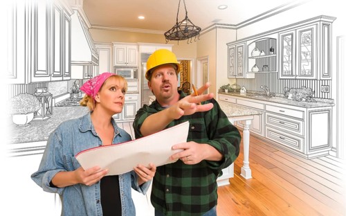 Contractor talking with customer over custom kitchen drawing and photo combination