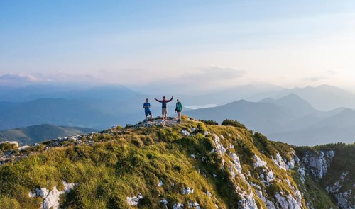 Three hikers at the summit