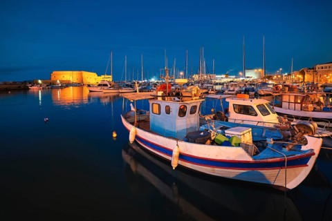 Venetian Fort Venetian fortress of Koules Castello a Mare castle in Heraklion and moored Greek fishing boats in port