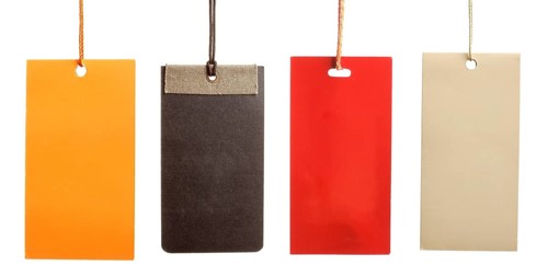 Sale written on paper tags isolated on white background