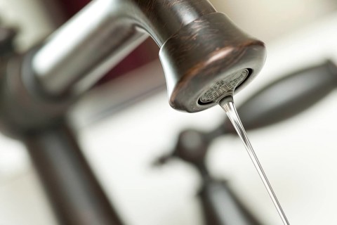 Close-up of water dripping from water faucet
