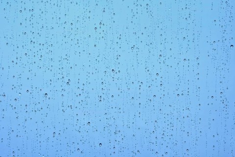 Rain water drops droplets on window glass texture background