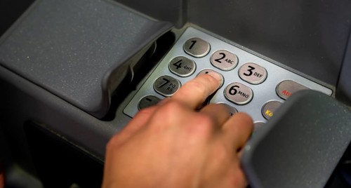 Hand at an ATM