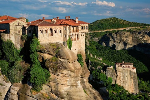 Monastery of Varlaam monastery and Monastery of Rousanou in famous greek tourist destination Meteora in Greece on sunset with scenic scenery landscape