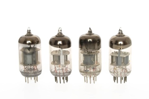 Old vacuum tubes on white background