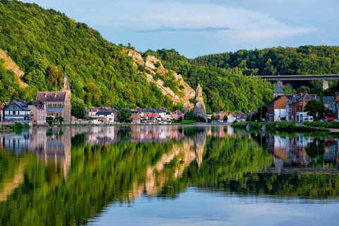 View of picturesque Dinant city over the Meuse river Dinant is a Walloon city and municipality located on the River Meuse
