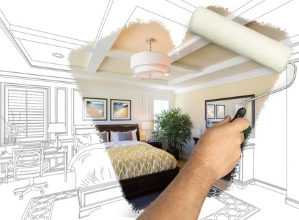 Before and after of man painting roller to reveal newly remodeled master bedroom under pencil drawing plans