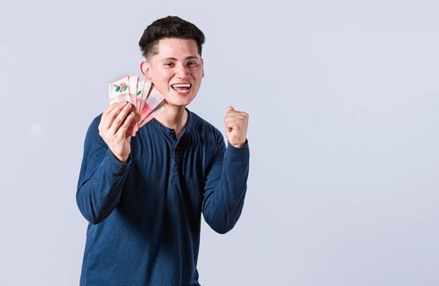 Excited man with money in his hand