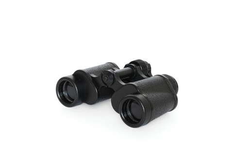 Black binoculars isolated on white background