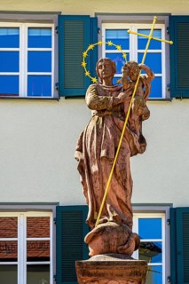 Figure of the Virgin Mary with baby Jesus and wreath of stars