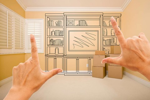Framing hands of shelf design drawing on wall in empty room
