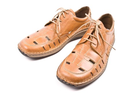 Two man's summer shoes isolated on white background